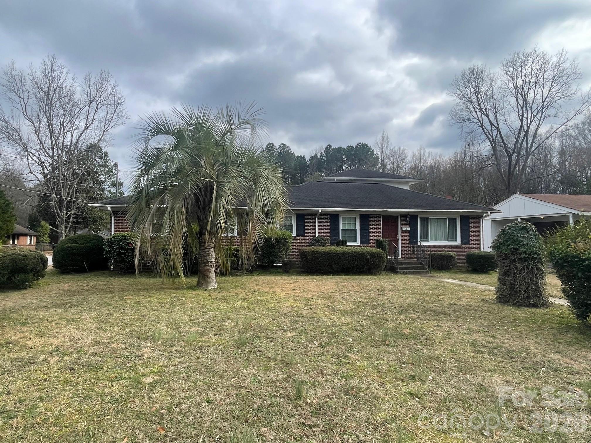 1529 West Market St Extension Cheraw, SC 29520 - Photo 2 of 38 a front view of a house with a yard