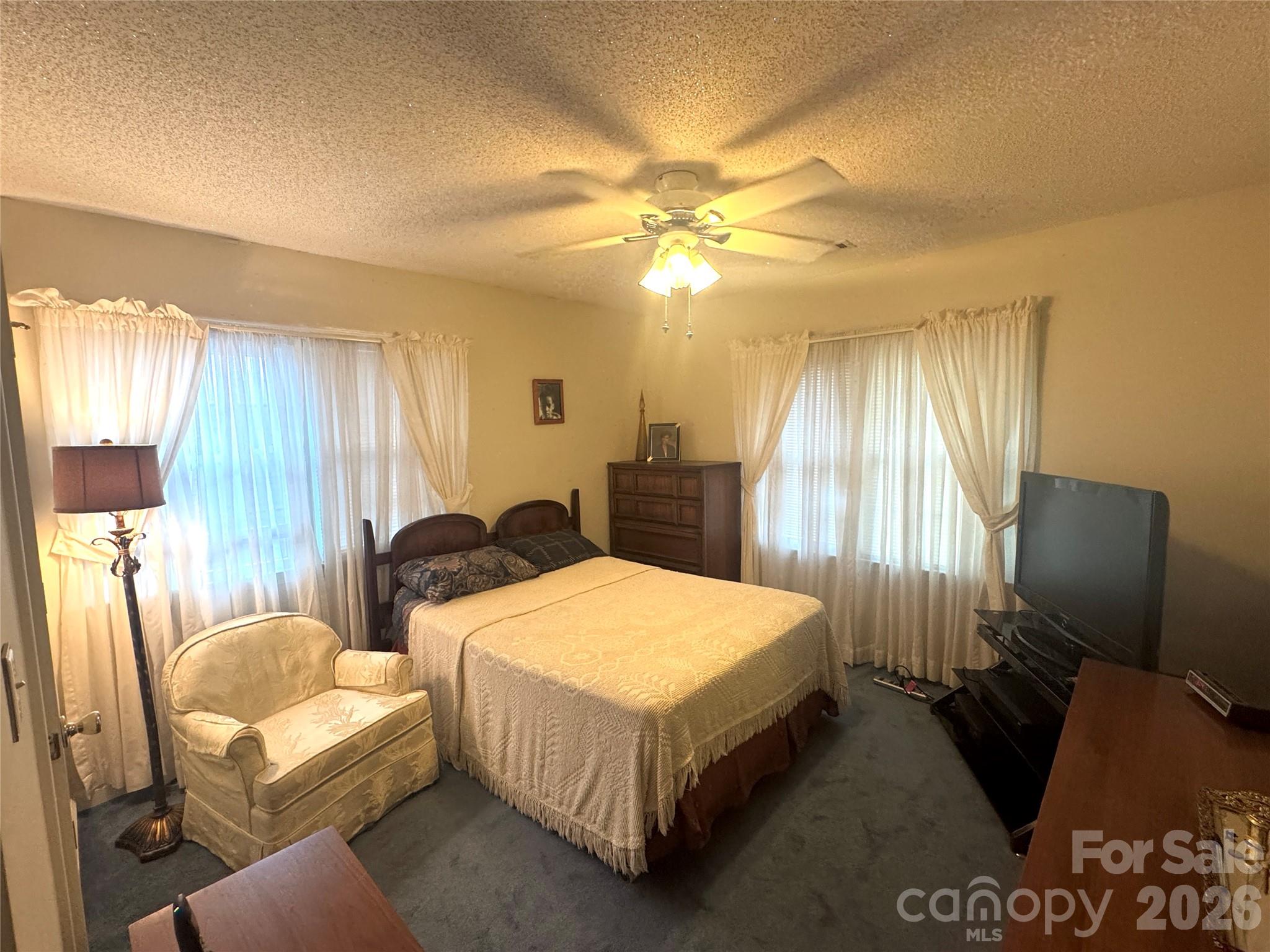 1529 West Market St Extension Cheraw, SC 29520 - Photo 25 of 38 a bed room with two bed and a chandelier