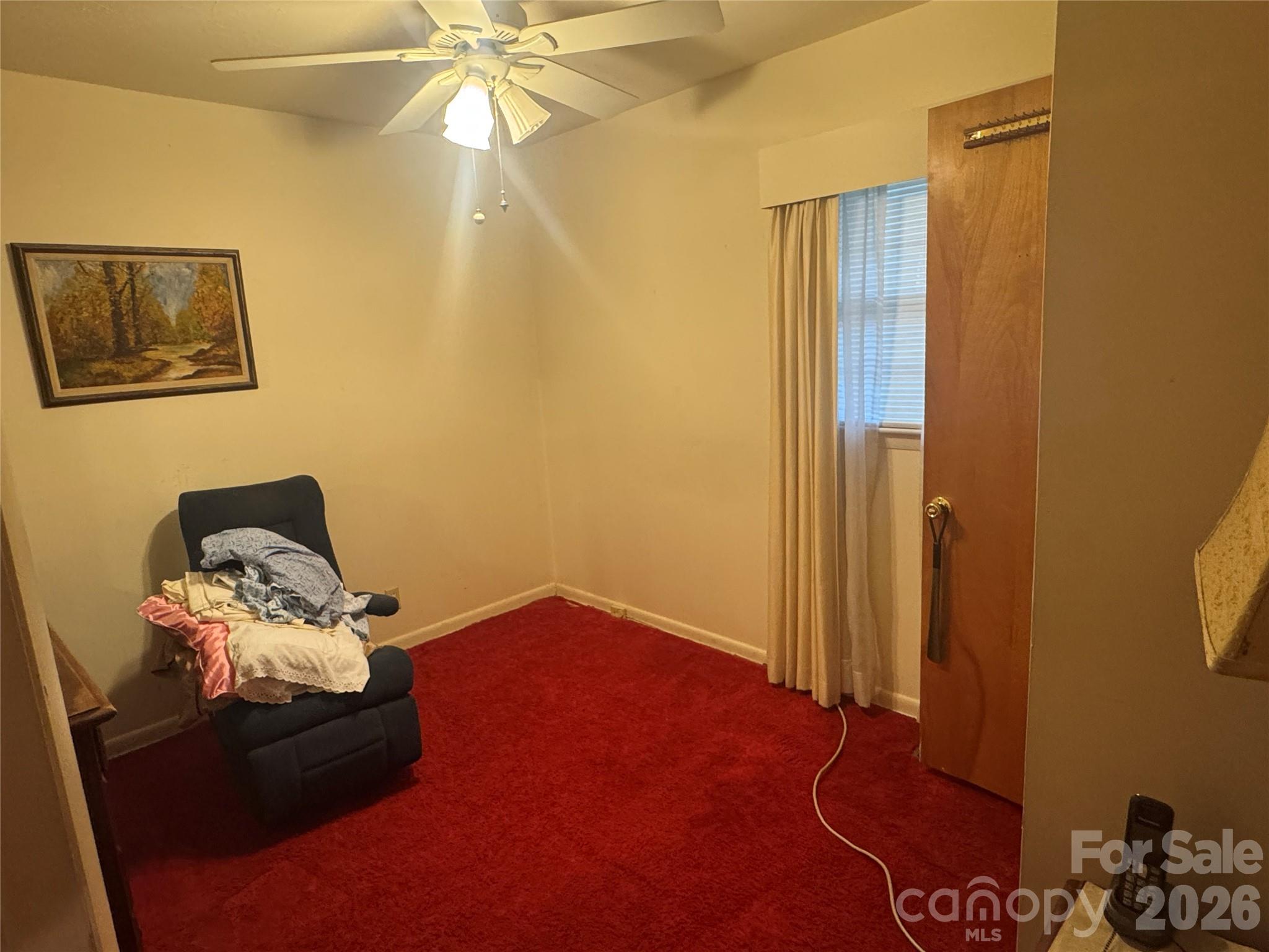 1529 West Market St Extension Cheraw, SC 29520 - Photo 26 of 38 a bedroom with a bed and a chandelier