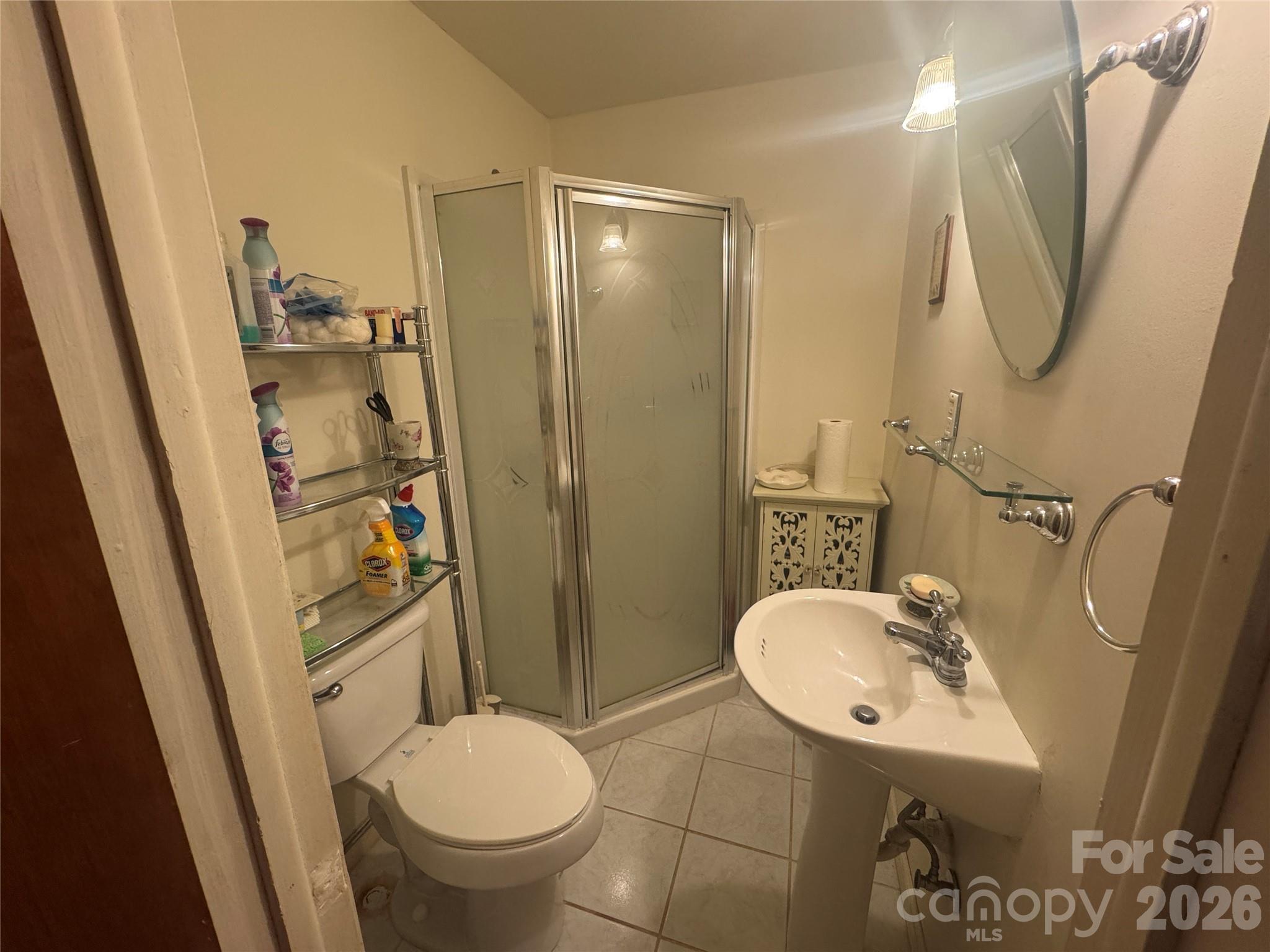 1529 West Market St Extension Cheraw, SC 29520 - Photo 27 of 38 a bathroom with a sink a toilet and shower