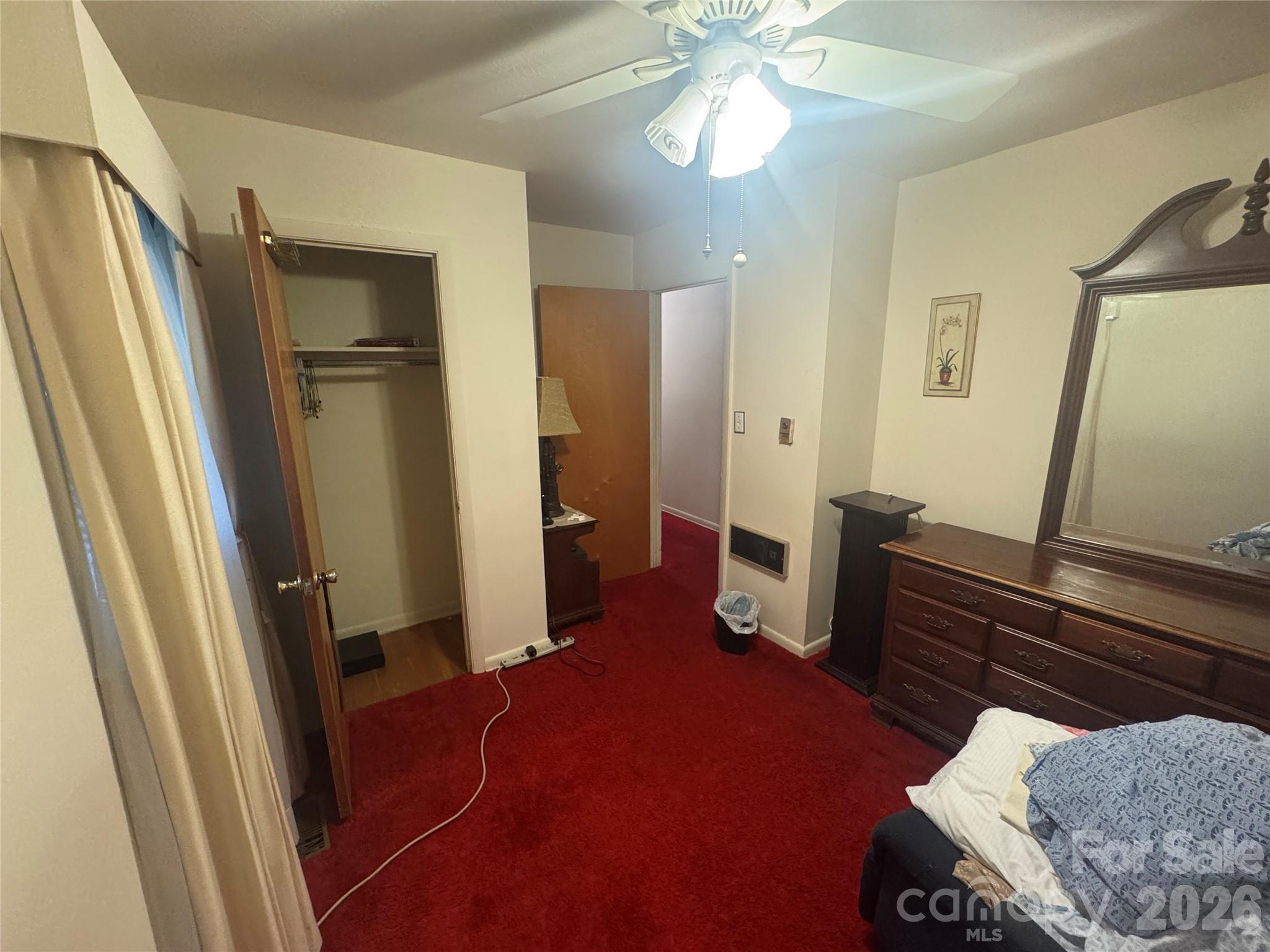 1529 West Market St Extension Cheraw, SC 29520 - Photo 28 of 38 a bedroom with furniture and a mirror