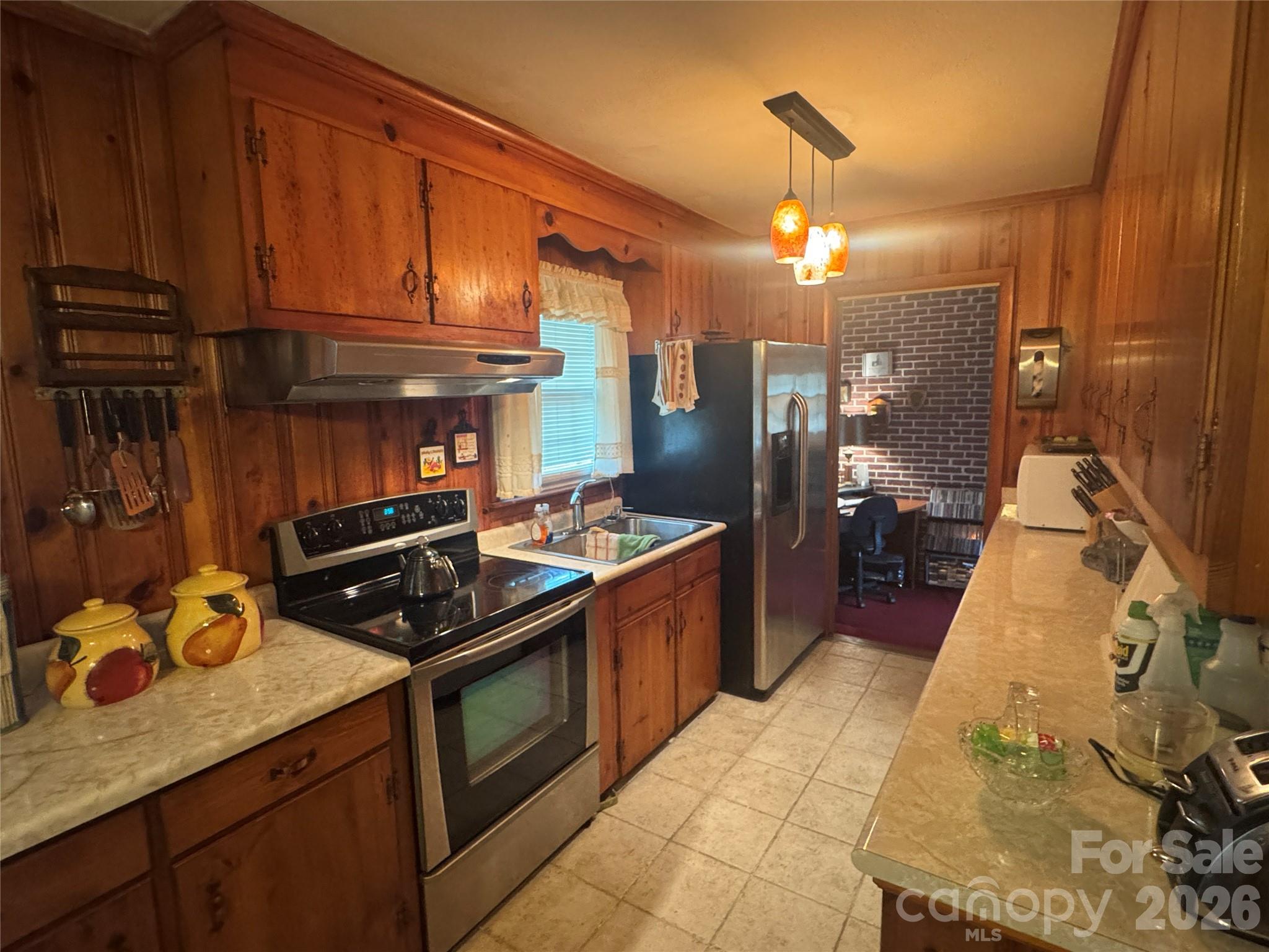 1529 West Market St Extension Cheraw, SC 29520 - Photo 33 of 38 a kitchen with stainless steel appliances granite countertop a stove and a refrigerator