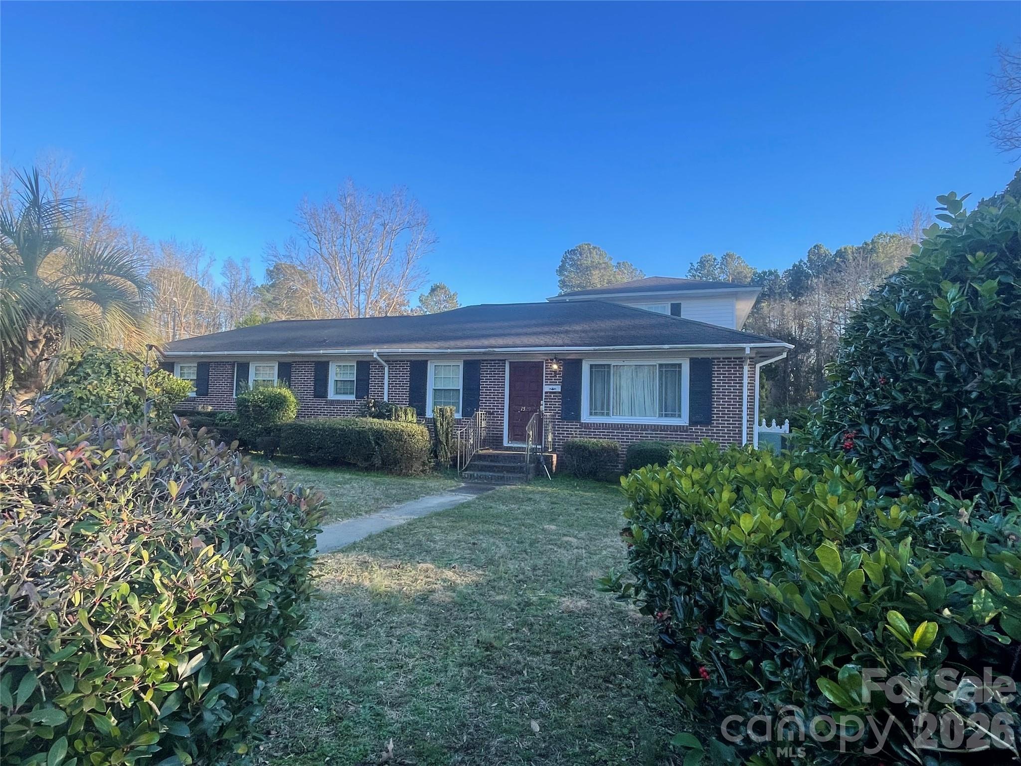 1529 West Market St Extension Cheraw, SC 29520 - Photo 38 of 38 a view of a yard in front of a house with large windows