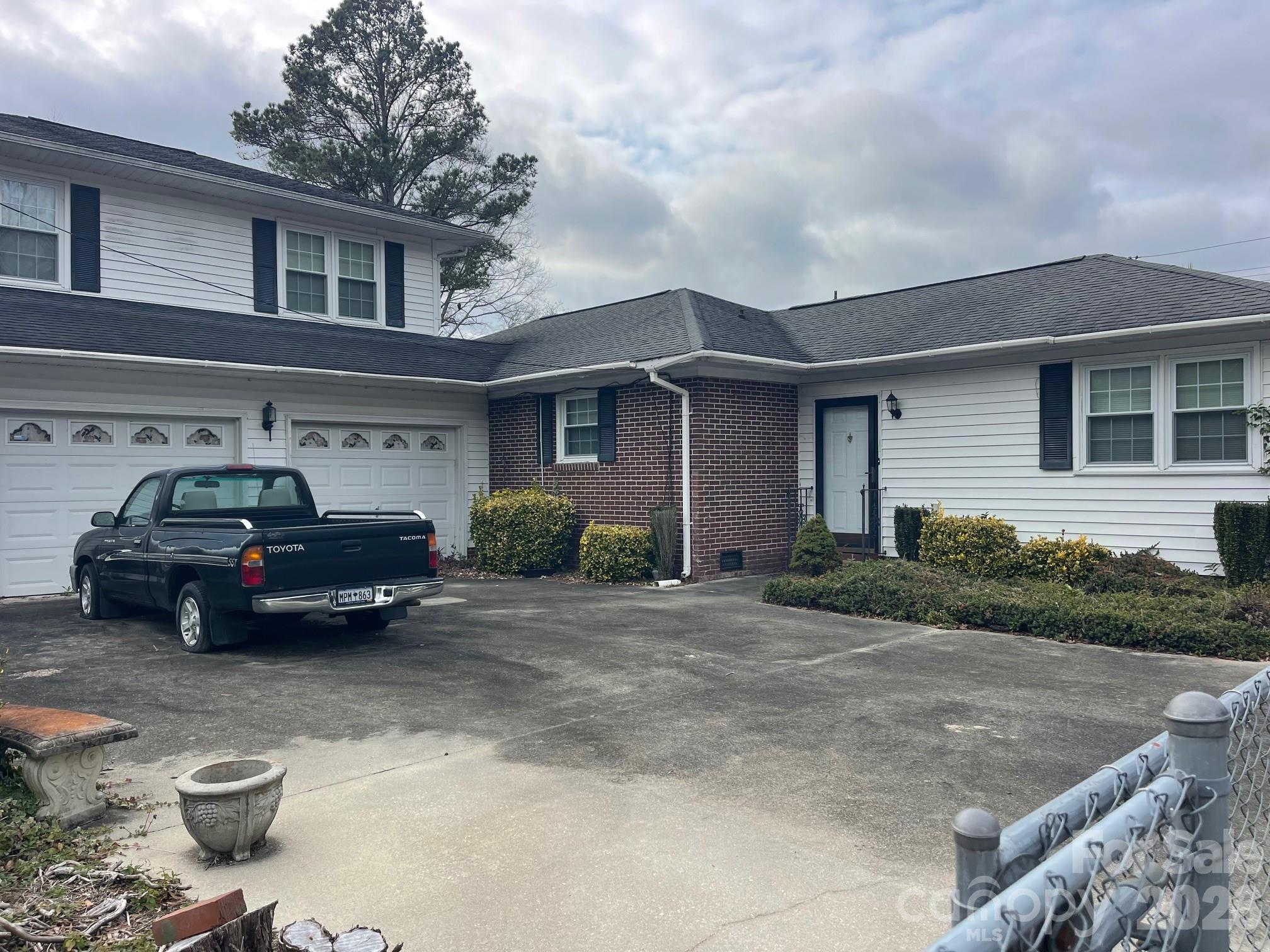 1529 West Market St Extension Cheraw, SC 29520 - Photo 6 of 38 a car parked in front of a house