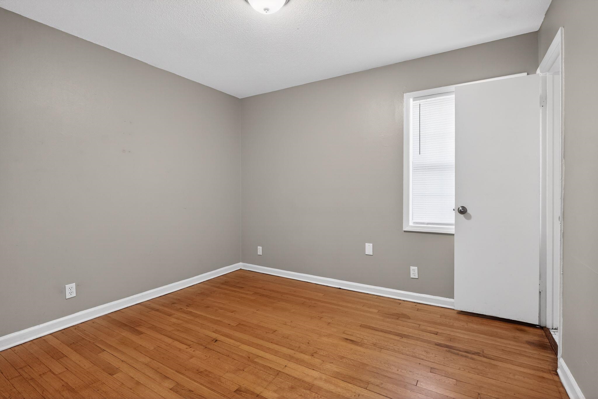 4285 Trudy Street Memphis, TN 38128 - Photo 16 of 31 Empty room featuring baseboards and light wood-style floors