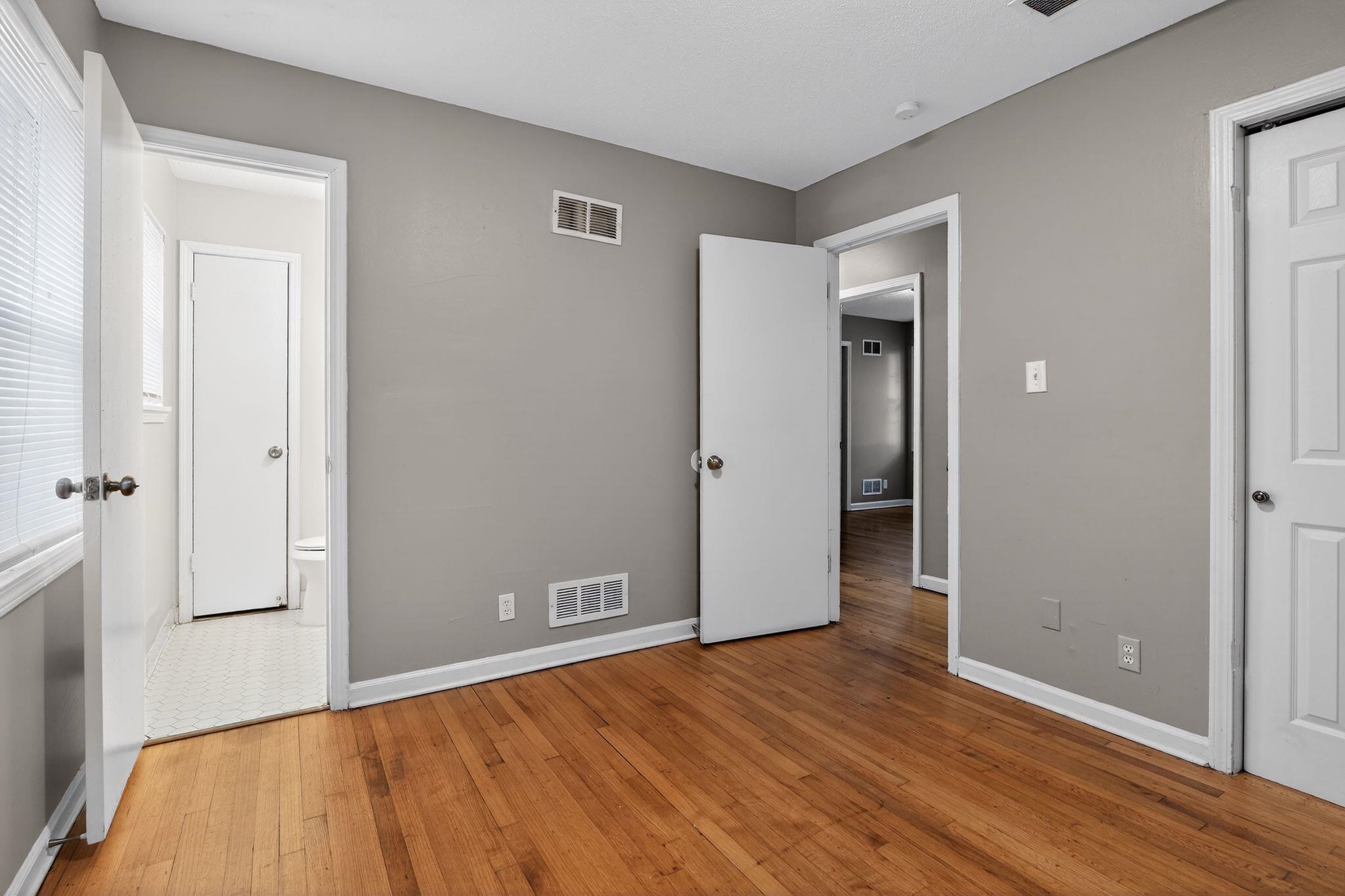 4285 Trudy Street Memphis, TN 38128 - Photo 18 of 31 Unfurnished bedroom featuring wood-type flooring and baseboards