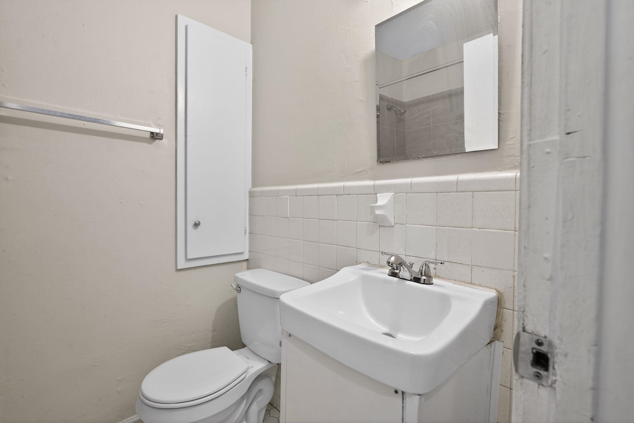 4285 Trudy Street Memphis, TN 38128 - Photo 20 of 31 Full bathroom with vanity, a shower, tile walls, and a wainscoted wall