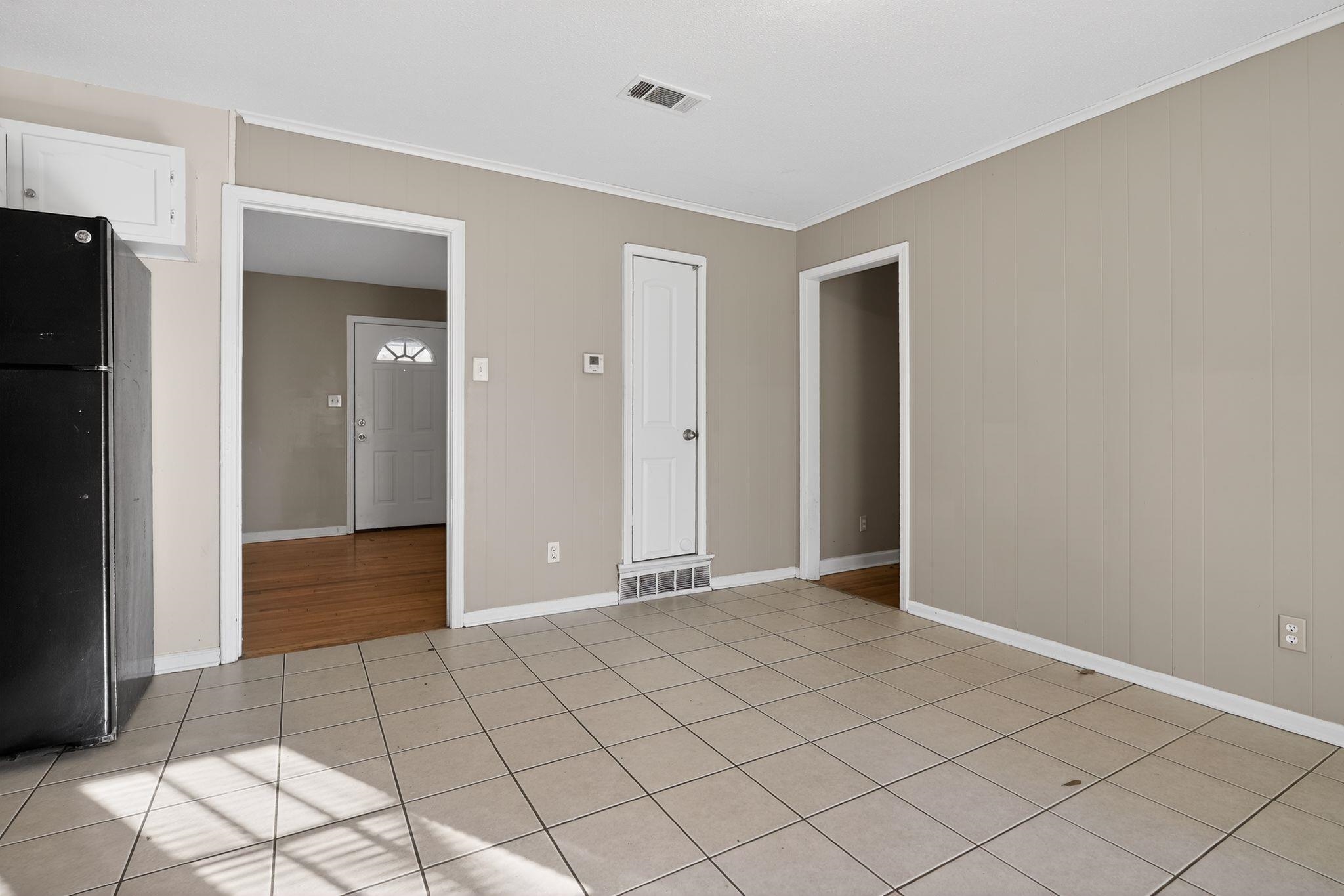 4285 Trudy Street Memphis, TN 38128 - Photo 8 of 31 Unfurnished bedroom with freestanding refrigerator, light tile patterned floors, and ornamental molding