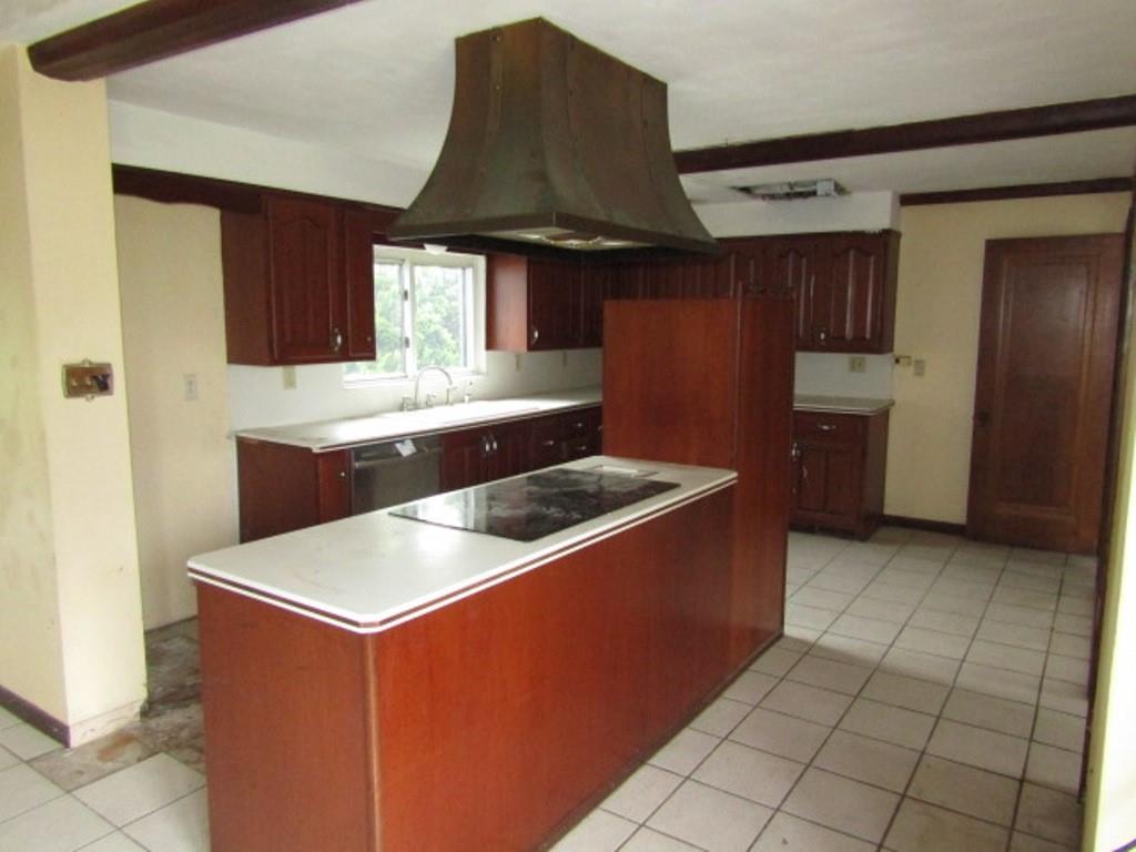 813 Coleman Drive Rochester, PA 15074 - Photo 11 of 33 a kitchen with stainless steel appliances granite countertop a sink a stove and a refrigerator