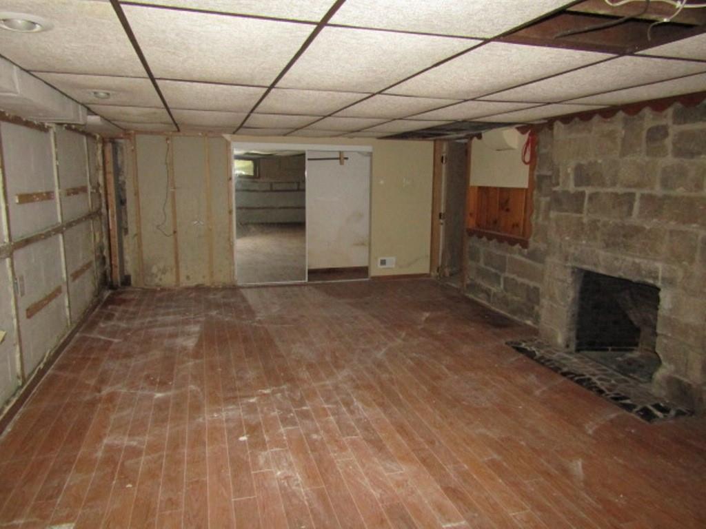 813 Coleman Drive Rochester, PA 15074 - Photo 32 of 33 a view of empty room with wooden floor and fireplace