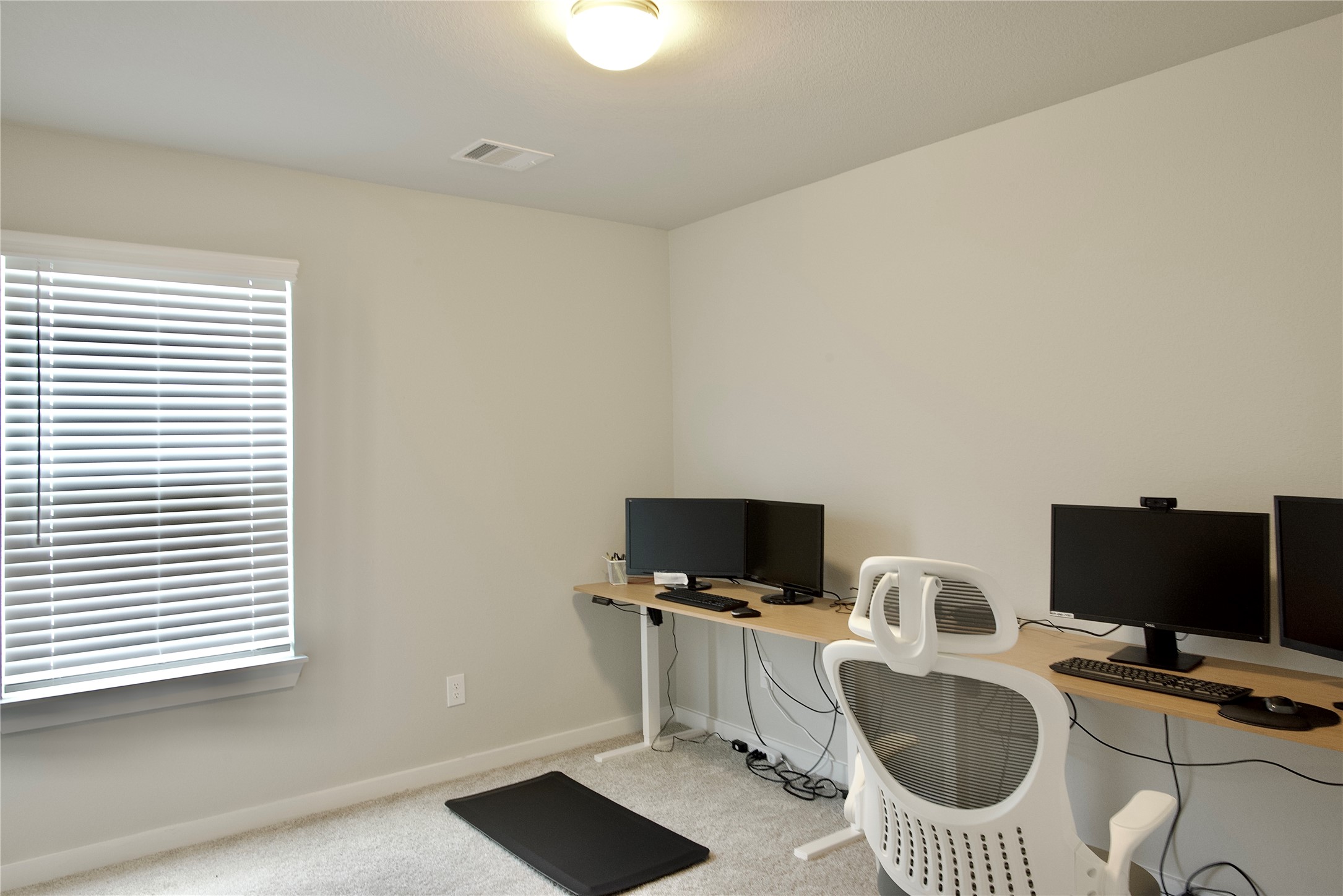 3207 Tilley Drive Rosenberg, TX 77471 - Photo 37 of 43 a view of a workspace with furniture and a flat screen tv