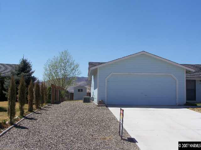 523 Yellow Jacket Road Dayton, NV 89403 - Photo 8 of 9 a front view of a house with a yard