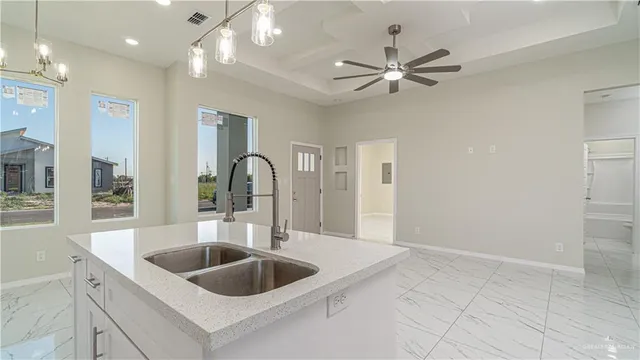 a kitchen with a sink and a refrigerator