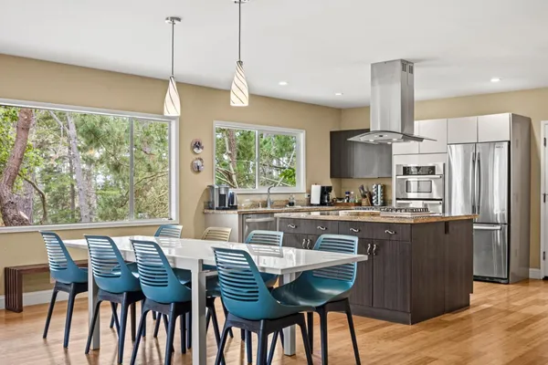 a view of a dining room with furniture window and wooden floor