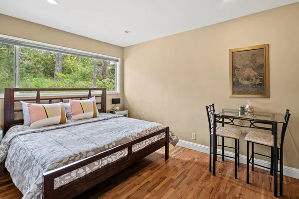 a bedroom with a bed and window