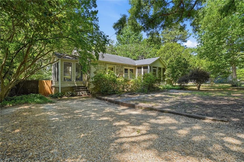 385 Sunset Drive Athens, GA 30606 - Photo 38 of 48 a front view of a house with a yard and a garage