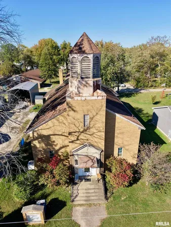 a aerial view of a house with a yard