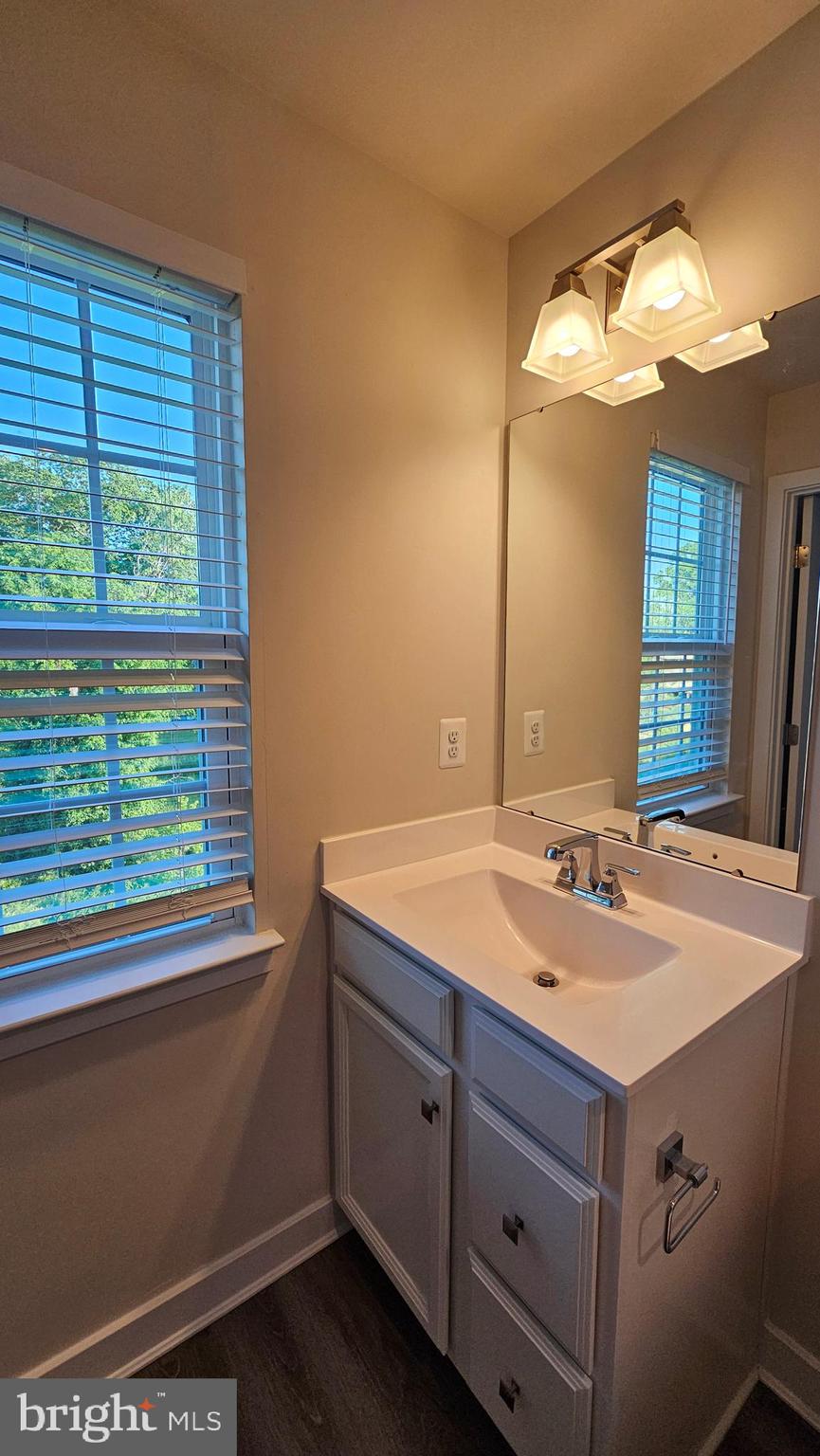 2055 Rivers Drive Newark, DE 19702 - Photo 43 of 48 a bathroom with a sink and a mirror