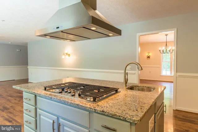 a kitchen with a stove and a sink
