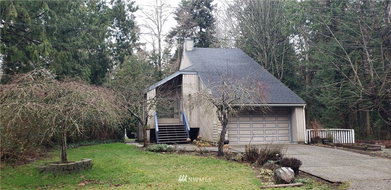 2254 Cedar Point Avenue Point Roberts, WA 98281 - Photo 2 of 39 a backyard of a house with table and chairs
