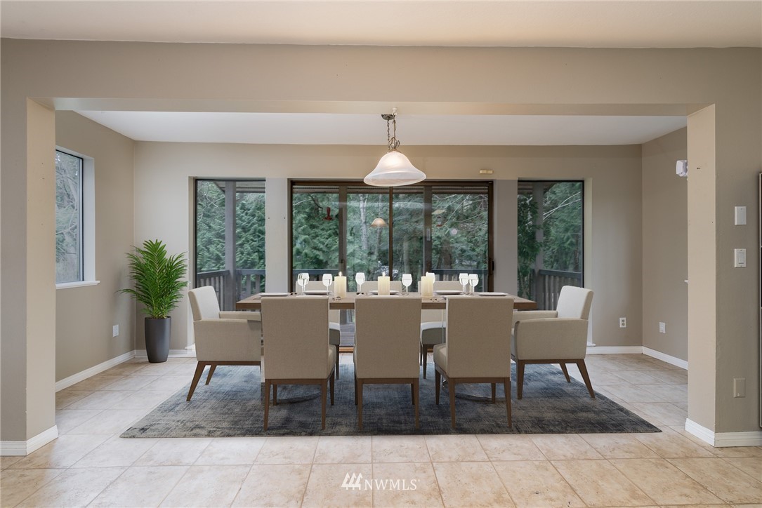 2254 Cedar Point Avenue Point Roberts, WA 98281 - Photo 15 of 39 a dining room with furniture a chandelier and wooden floor