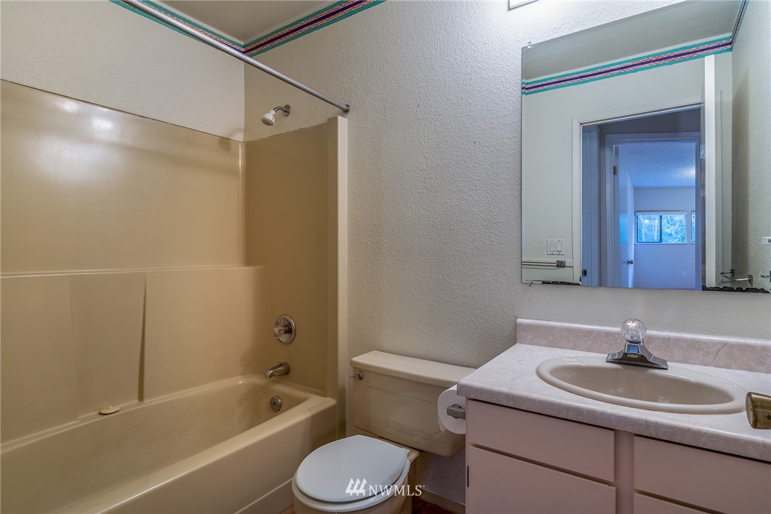 2254 Cedar Point Avenue Point Roberts, WA 98281 - Photo 23 of 39 a bathroom with a sink toilet tub vanity and shower