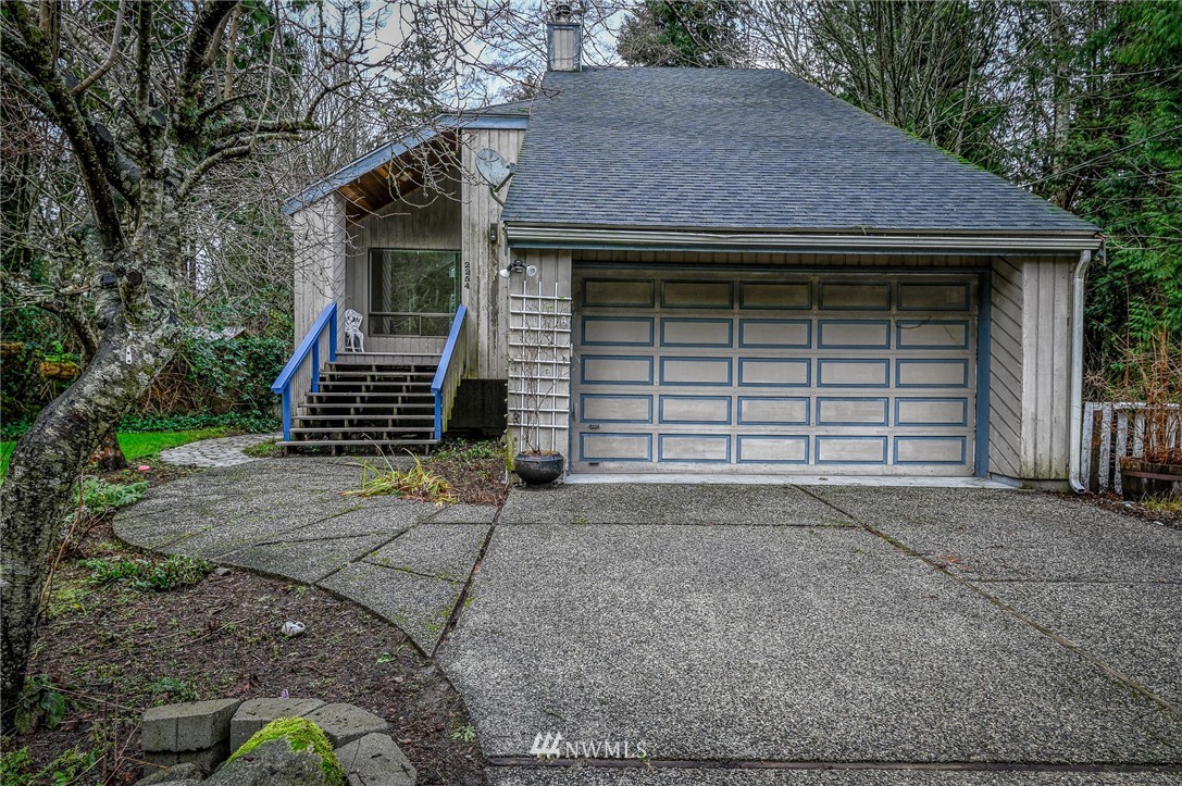2254 Cedar Point Avenue Point Roberts, WA 98281 - Photo 4 of 39 a front view of a house with a yard and garage