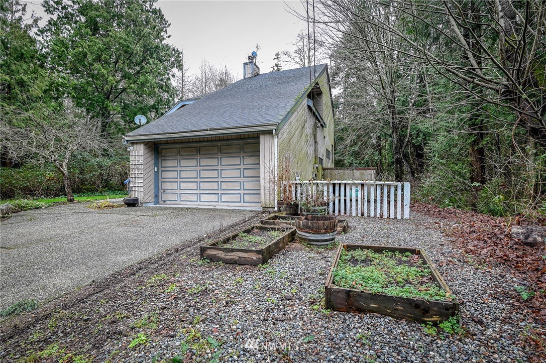 2254 Cedar Point Avenue Point Roberts, WA 98281 - Photo 6 of 39 a front view of a house with garden