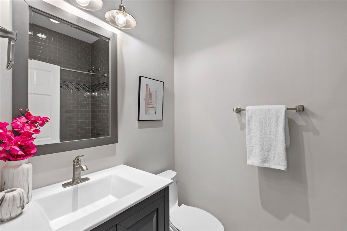 1867 North Halsted Street, Unit 1N Chicago, IL 60614 - Photo 20 of 30 a bathroom with a sink vanity and toilet