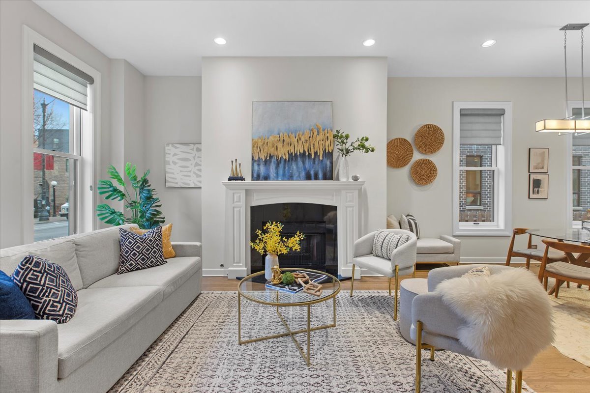 1867 North Halsted Street, Unit 1N Chicago, IL 60614 - Photo 2 of 30 a living room with furniture a fireplace and a table