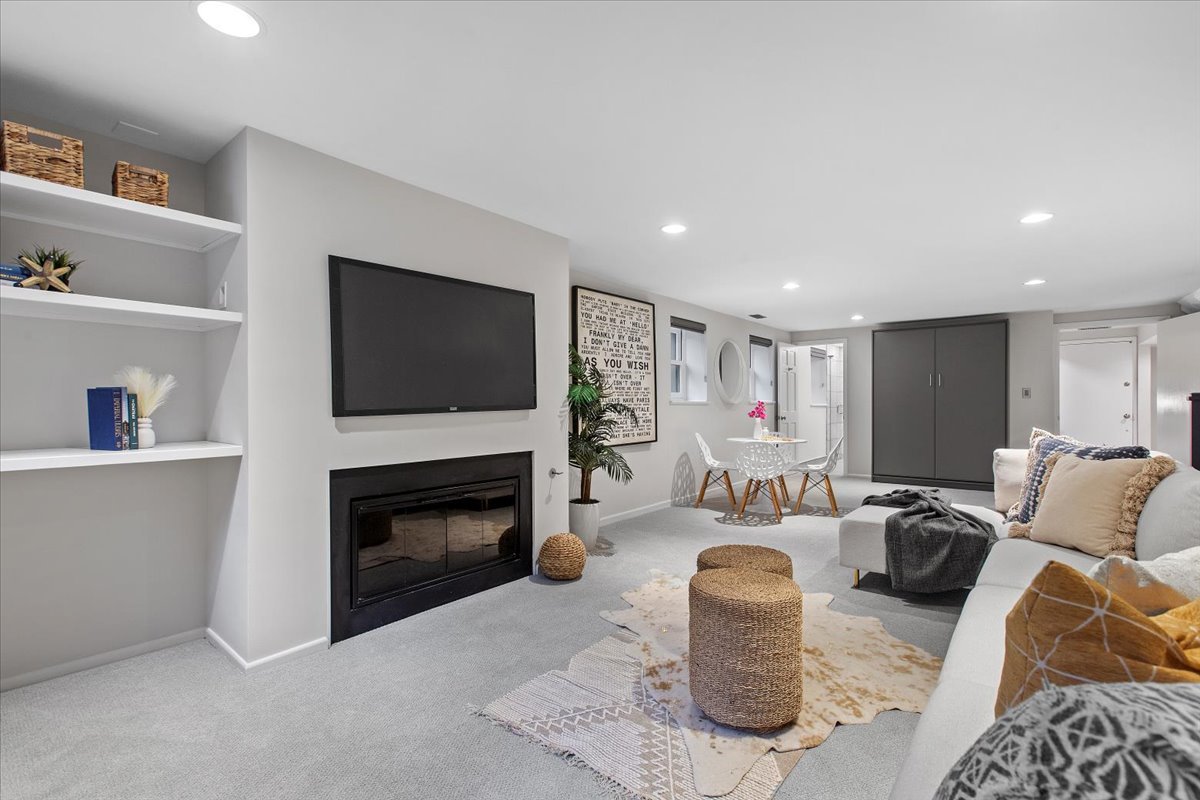 1867 North Halsted Street, Unit 1N Chicago, IL 60614 - Photo 23 of 30 a living room with furniture a flat screen tv and a fireplace