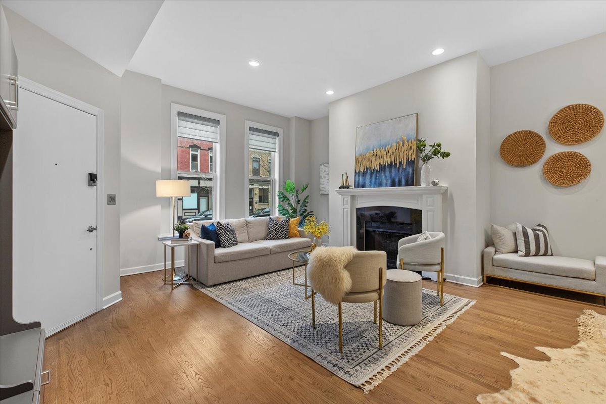 1867 North Halsted Street, Unit 1N Chicago, IL 60614 - Photo 3 of 30 a living room with furniture and a fireplace