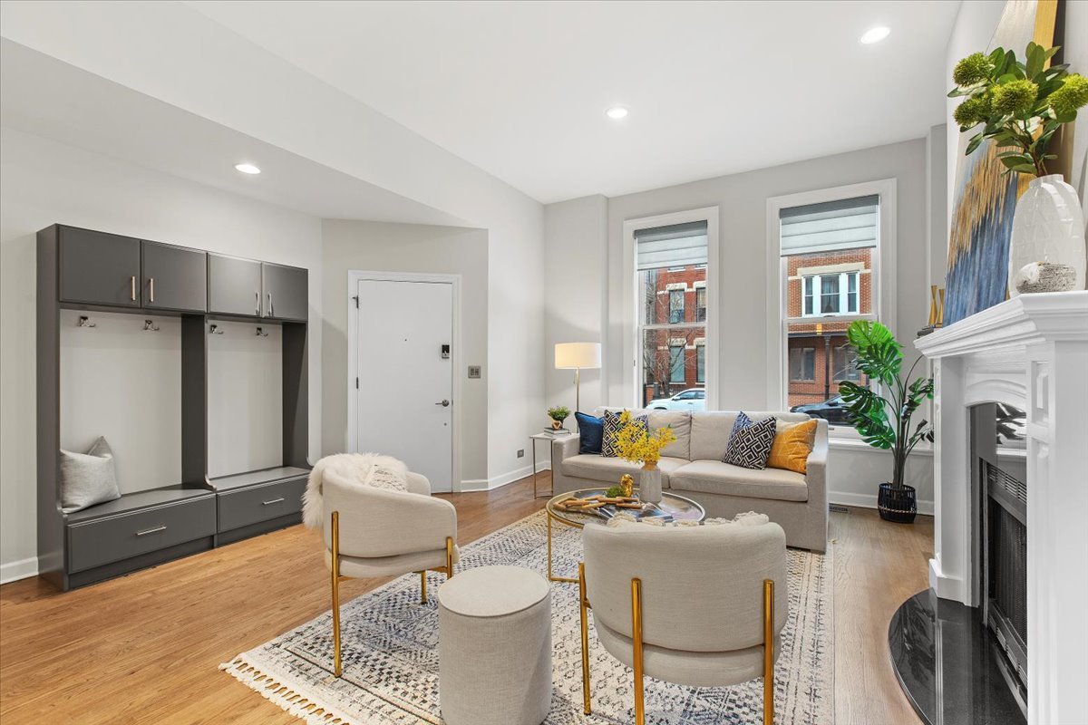 1867 North Halsted Street, Unit 1N Chicago, IL 60614 - Photo 4 of 30 a living room with furniture a fireplace and a table