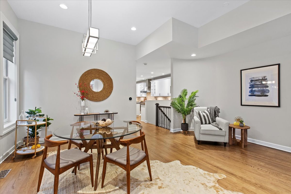 1867 North Halsted Street, Unit 1N Chicago, IL 60614 - Photo 10 of 30 a living room with furniture kitchen view and a chandelier