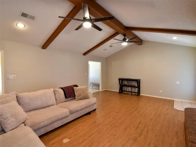 a view of a dining room with furniture and windows