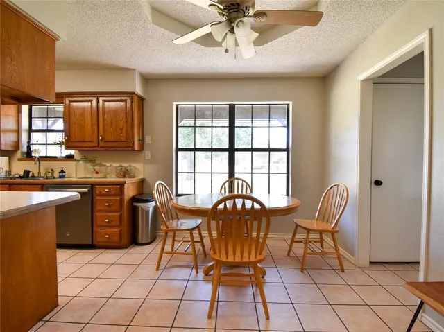 a dining room with furniture and a chandelier