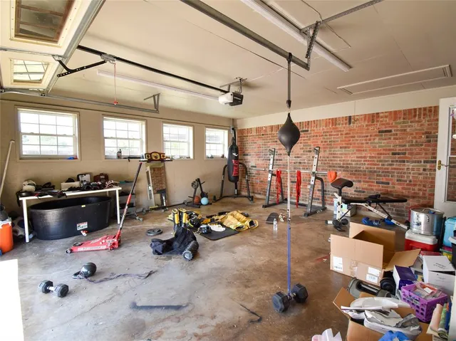 a view of hallway with couch and a window