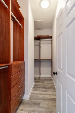 a bathroom with a sink a mirror and a shower
