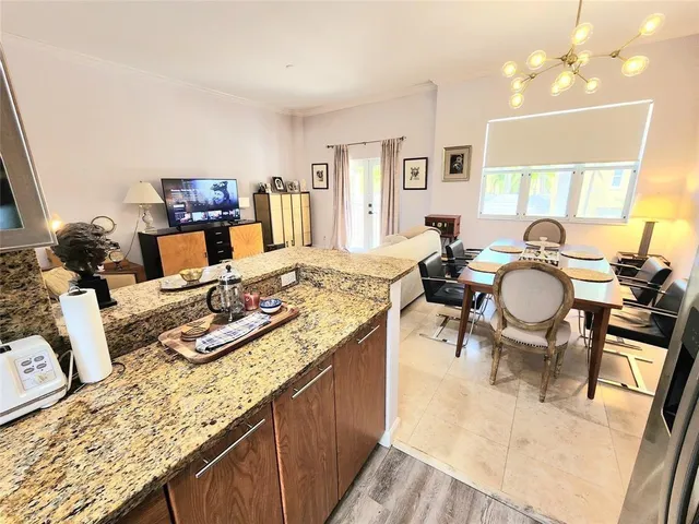 a very nice looking dining room with furniture