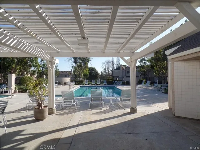 a front view of a house with car parked