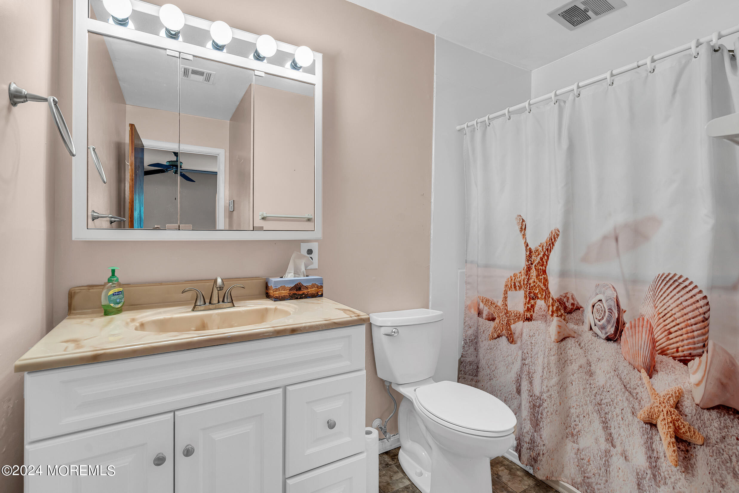 141 B Azalea Drive Whiting, NJ 08759 - Photo 14 of 17 a bathroom with a sink a toilet and a mirror