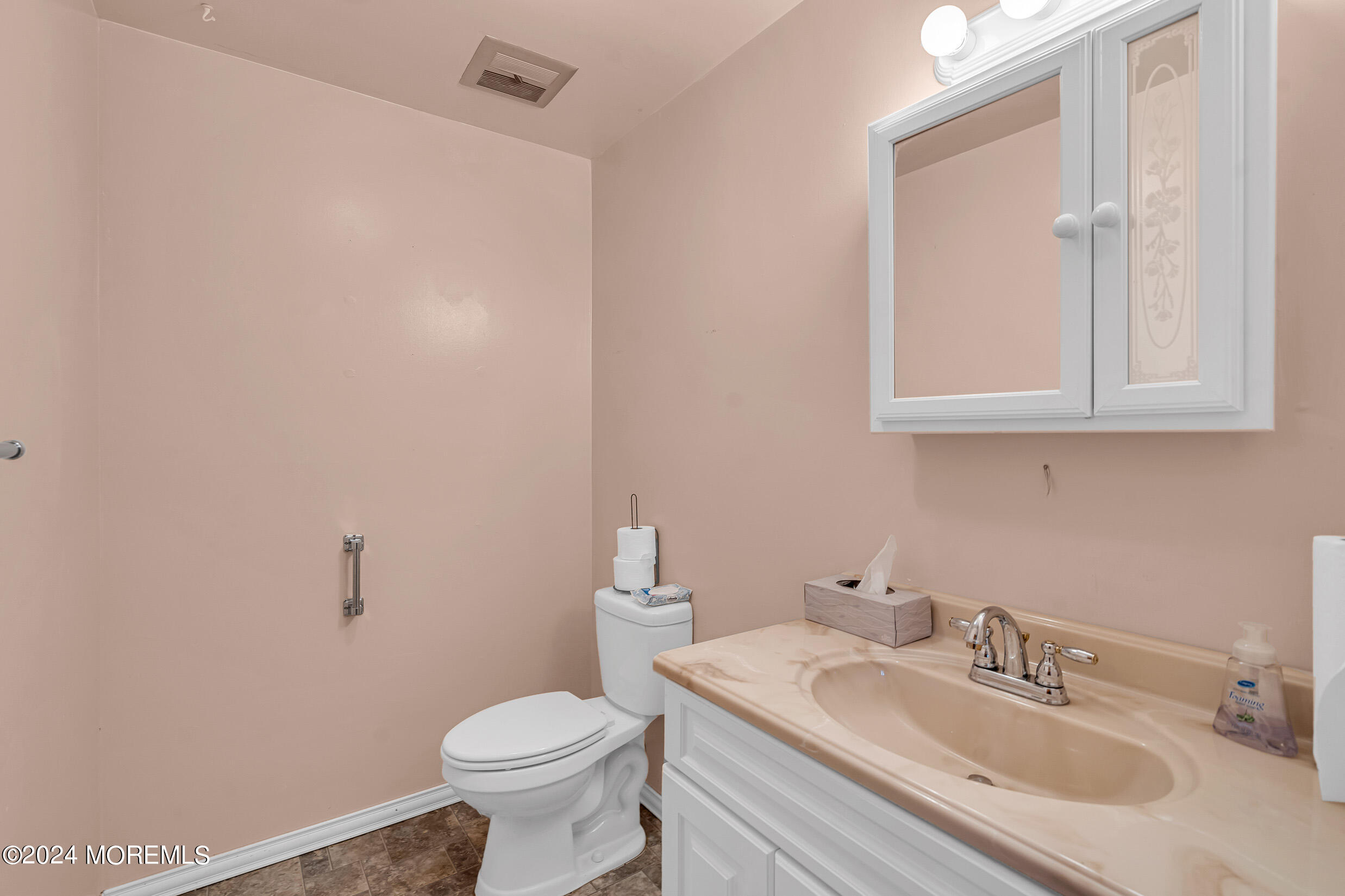 141 B Azalea Drive Whiting, NJ 08759 - Photo 15 of 17 a bathroom with a granite countertop sink a toilet and a mirror