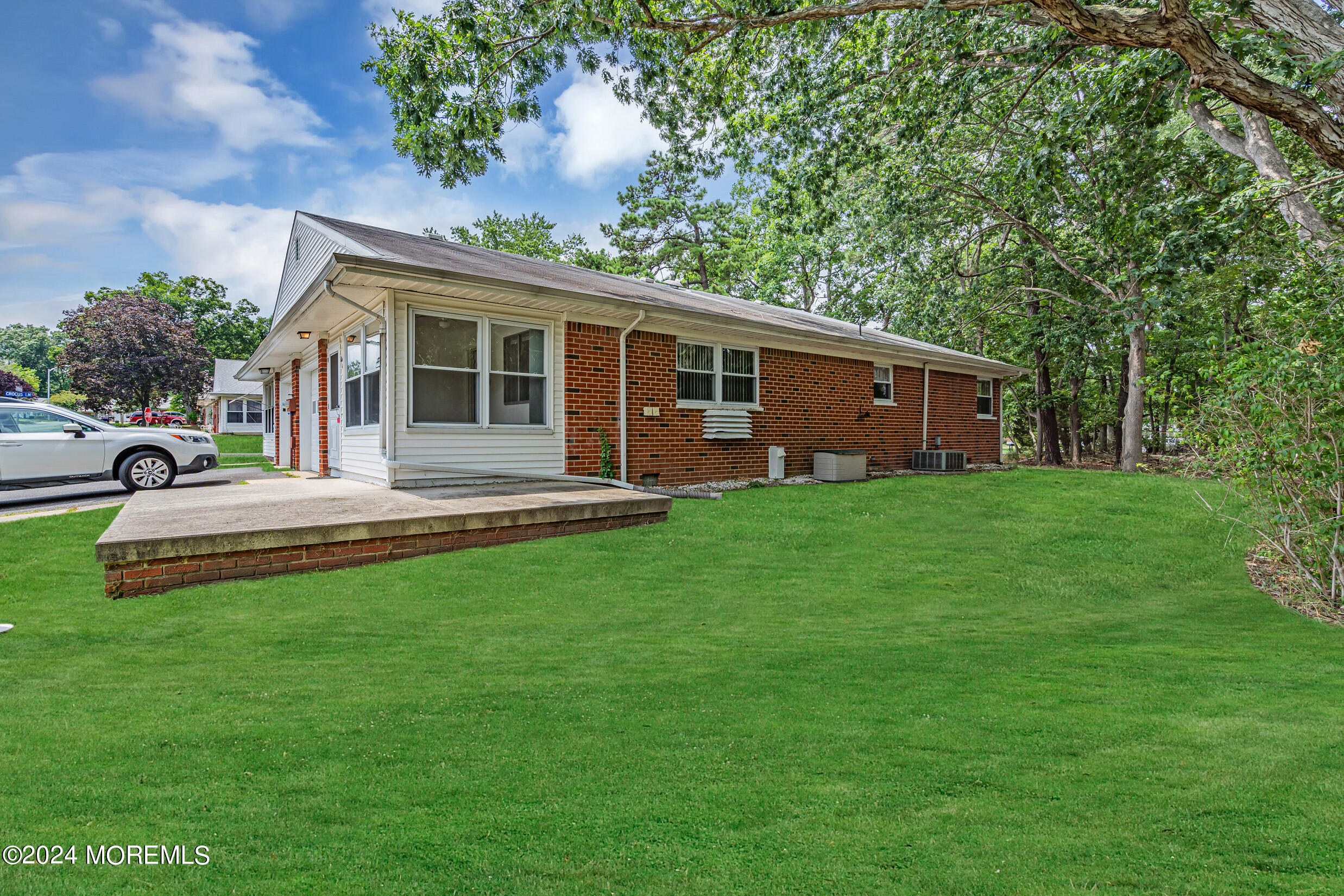 141 B Azalea Drive Whiting, NJ 08759 - Photo 16 of 17 a front view of house with yard and green space
