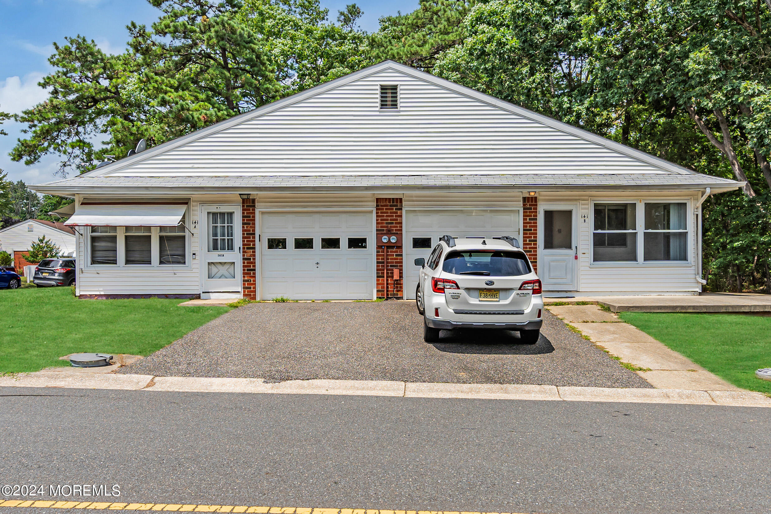 141 B Azalea Drive Whiting, NJ 08759 - Photo 3 of 17 a car parked in front of a house