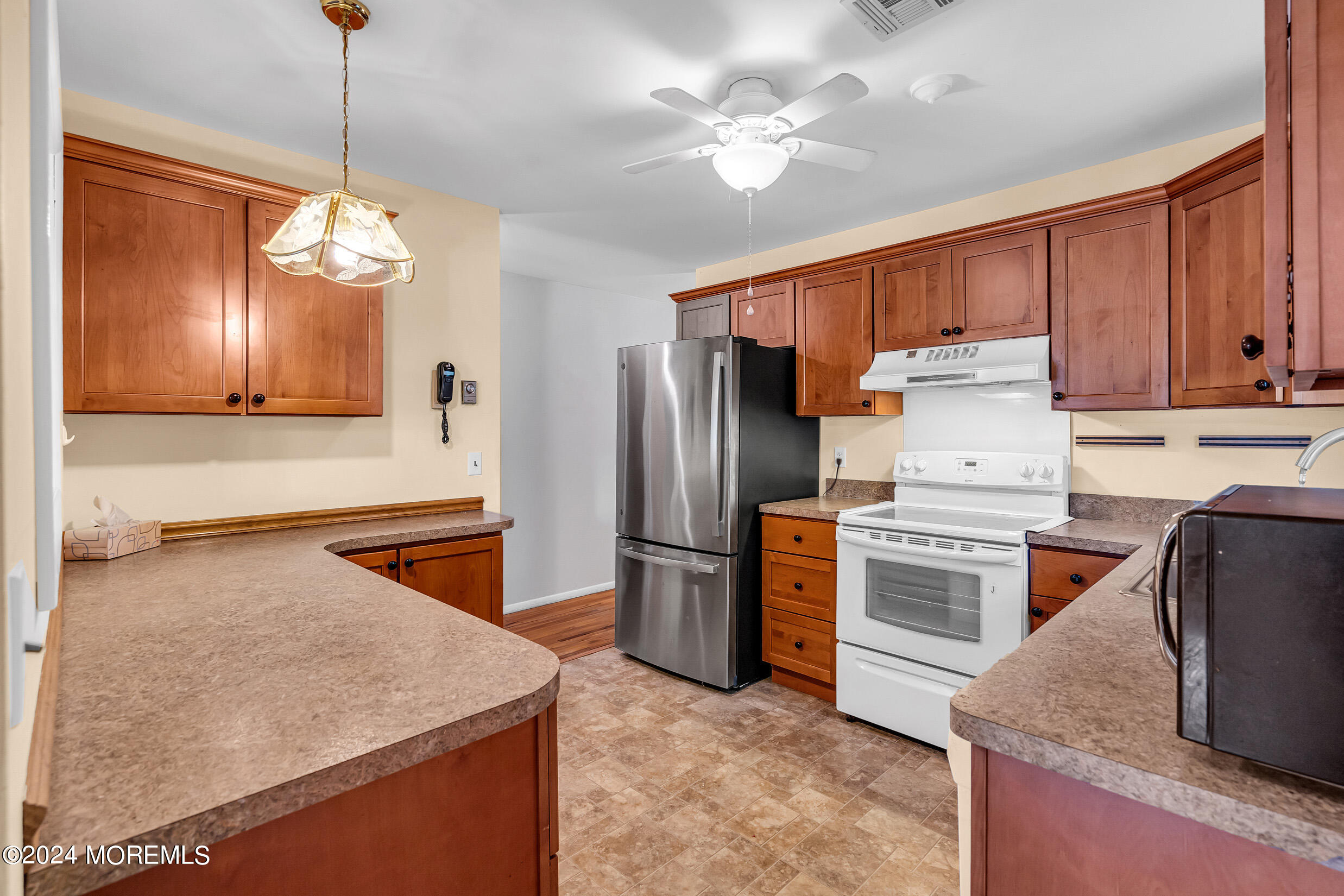 141 B Azalea Drive Whiting, NJ 08759 - Photo 9 of 17 a kitchen with refrigerator cabinets and a sink
