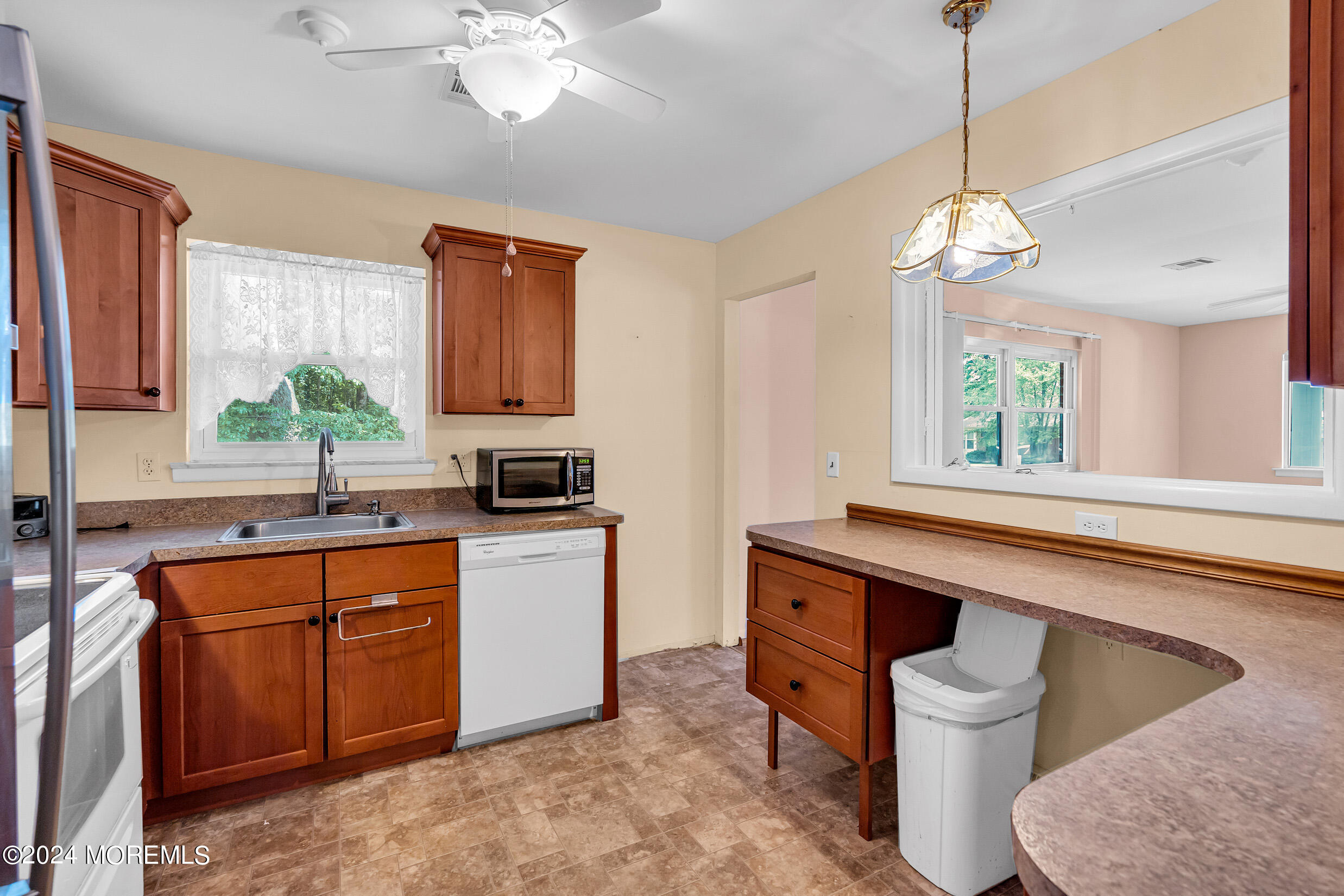 141 B Azalea Drive Whiting, NJ 08759 - Photo 10 of 17 a kitchen with a sink cabinets and window