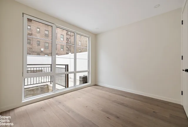 a view of white house with a large window