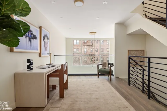a view of living room with furniture and flowers
