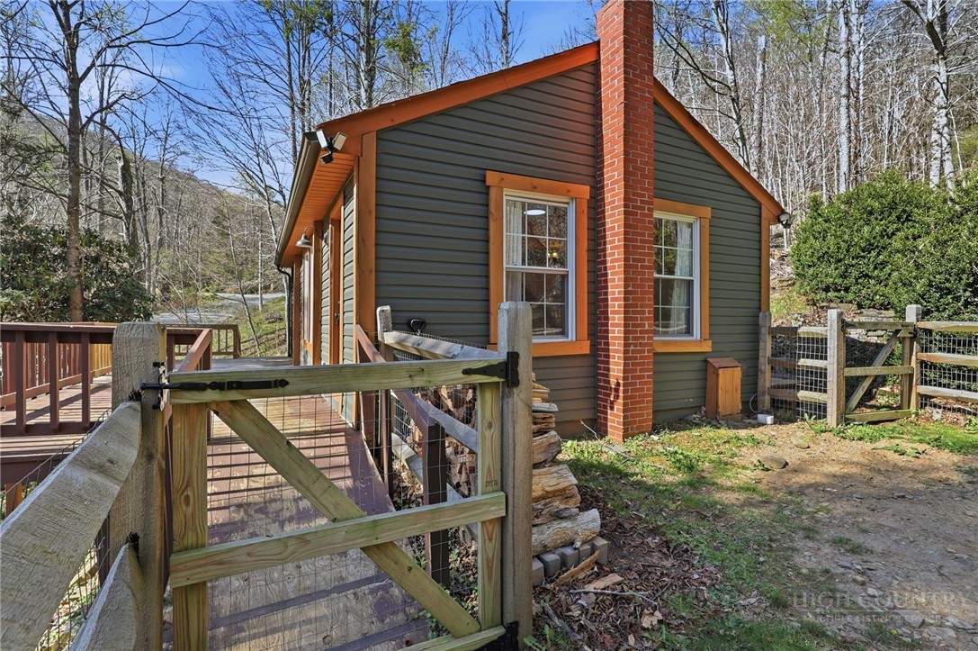 286 Grady Winkler Road Boone, NC 28607 - Photo 2 of 13 a view of a house with backyard and deck