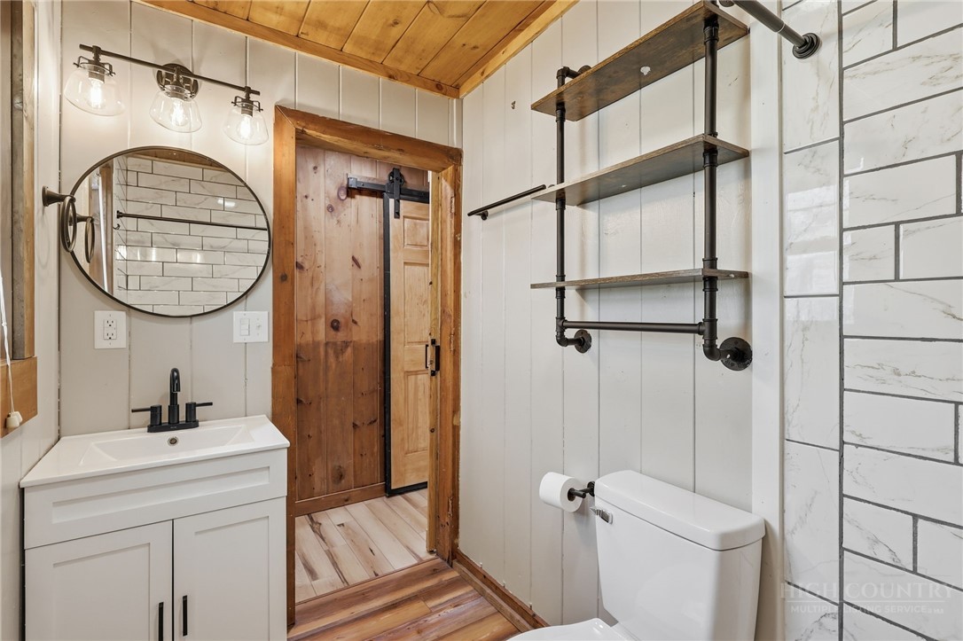 286 Grady Winkler Road Boone, NC 28607 - Photo 5 of 13 a bathroom with a sink a toilet and a mirror